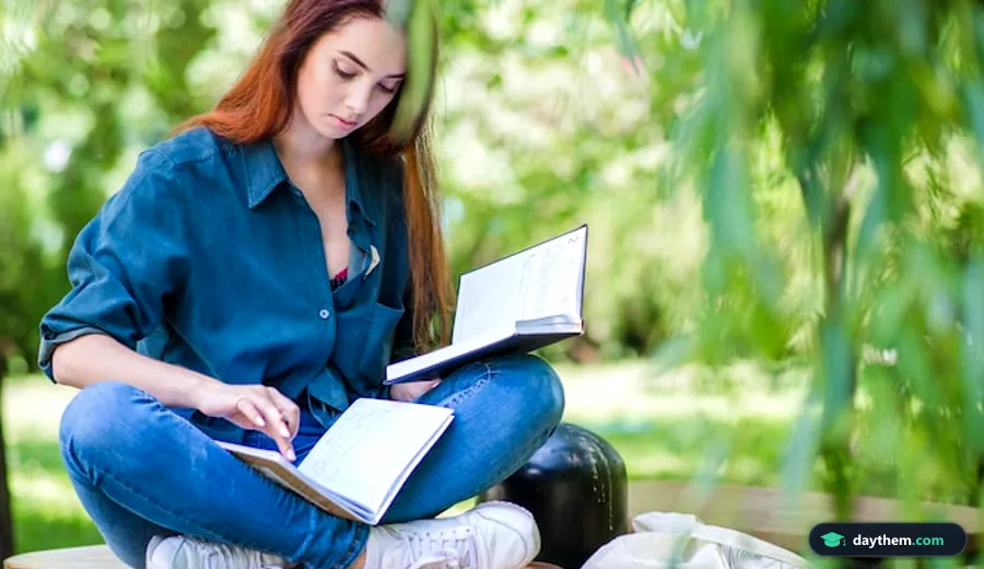 Phụ nữ trẻ ngồi đọc sách chăm chú trong công viên, minh họa cho tư duy học thuật và cấp độ chuyên sâu DALF C1 C2.